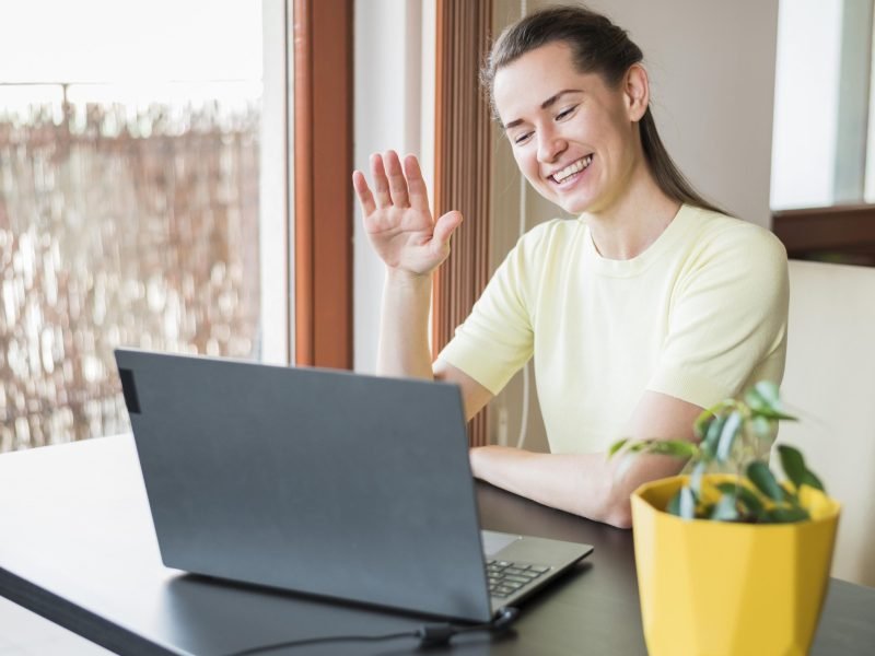 front-view-woman-having-video-call